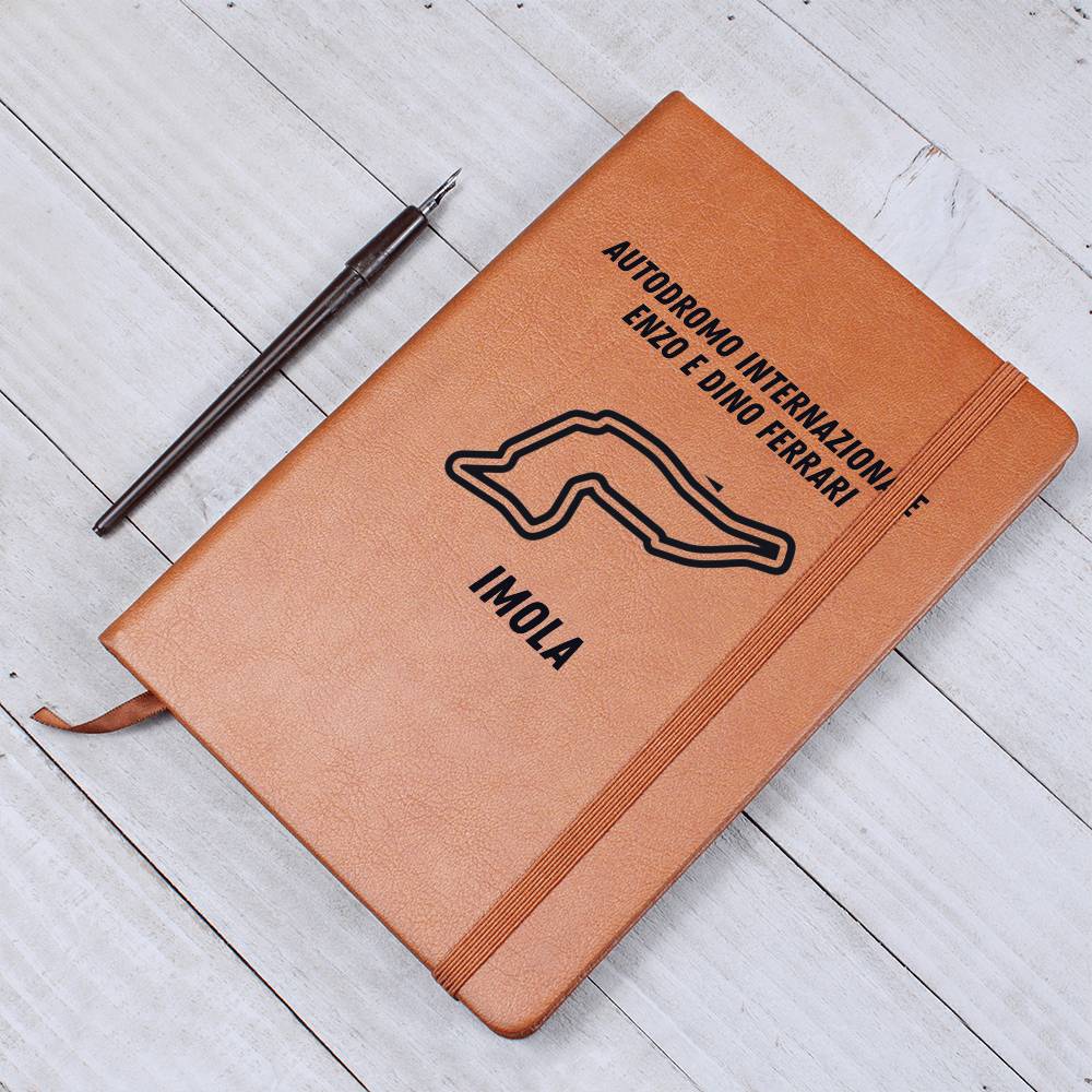 Race track notebook for f1 fans paired with a pen