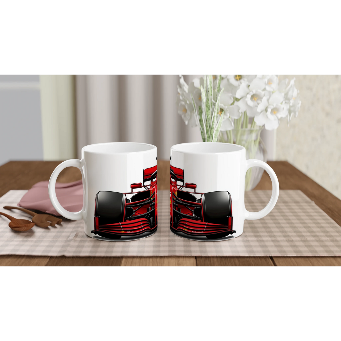 Two F1 mugs featuring red F1 race cars side by side on table