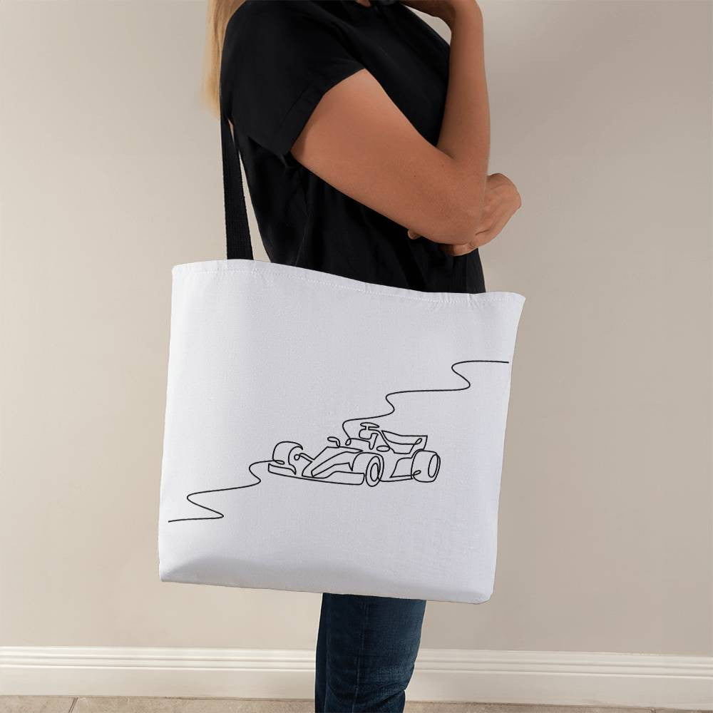 White canvas tote back with black straps featuring F1 inspired circuit and race car