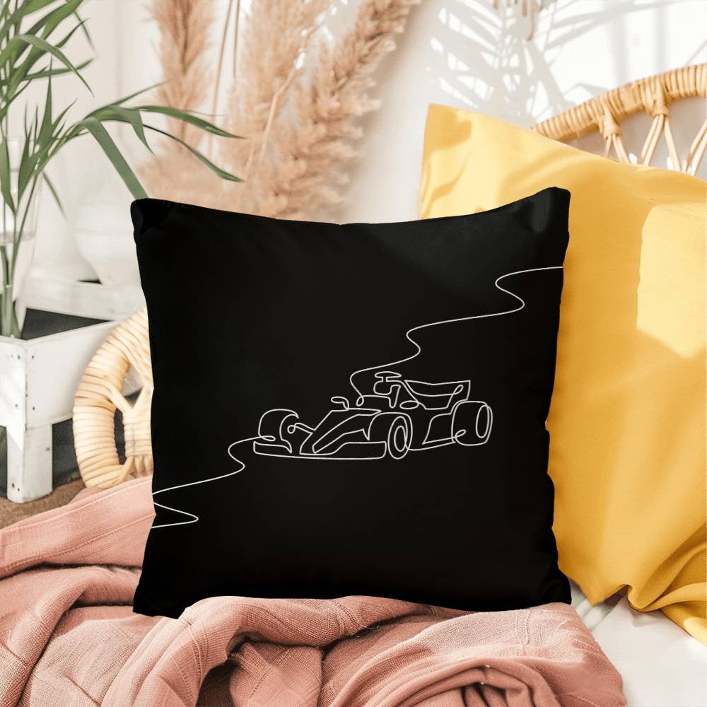 Black F1 merch pillow featuring white illustrated race car