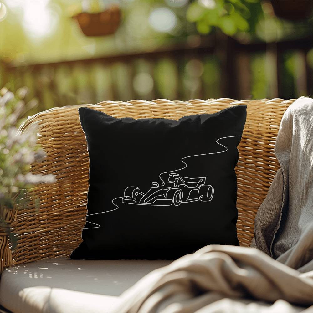 Black F1 merch pillow in black with white illustrated race car
