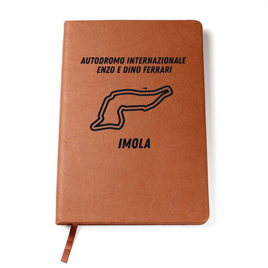 Brown F1 circuit track notebook on blank background
