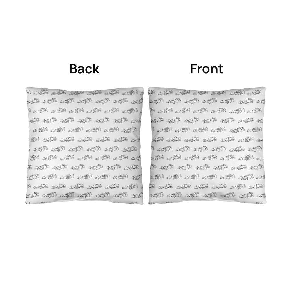 Front and back sides of F1 pillow merch that's white with black F1 cars