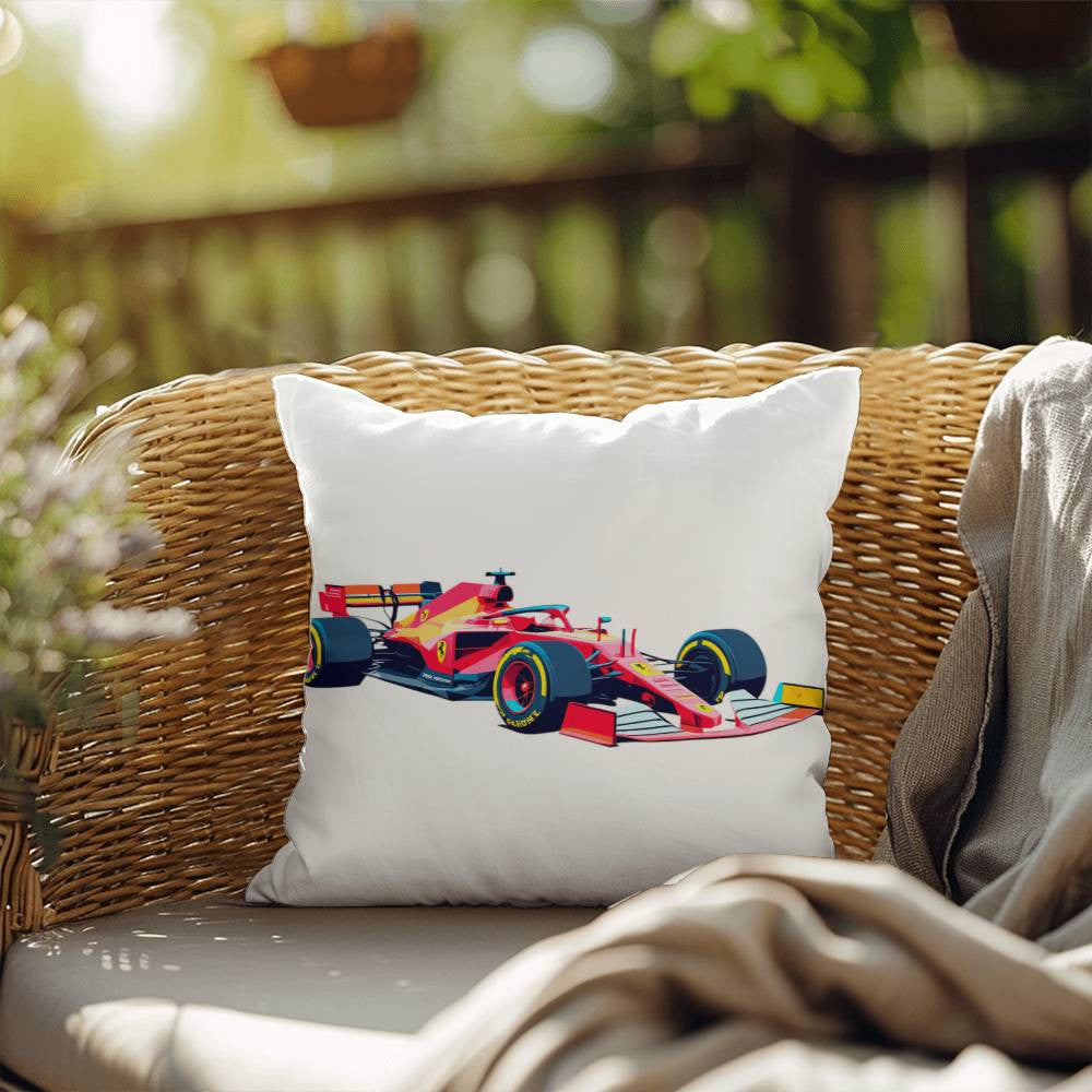 White F1 pillow featuring a red F1 racecar sitting on a wicker patio chair
